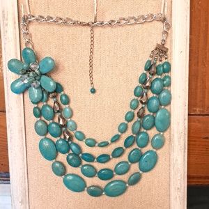 Beautiful four strand, faux turquoise beaded necklace